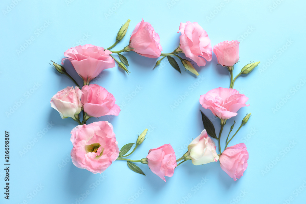 Flat lay composition with beautiful Eustoma flowers on color background Flat lay composition with beautiful Eustoma flowers on color background