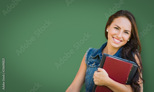 Blank Chalk Board Behind Mixed Race Young Girl Student Holding Books