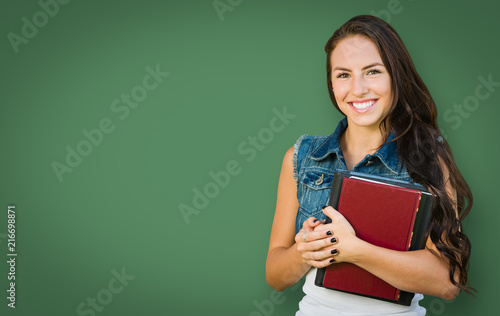 Blank Chalk Board Behind Mixed Race Young Girl Student Holding Books