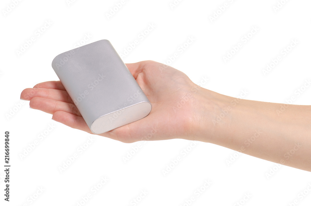 Gray power bank in hand on white background isolation Gray power bank in hand on white background isolation