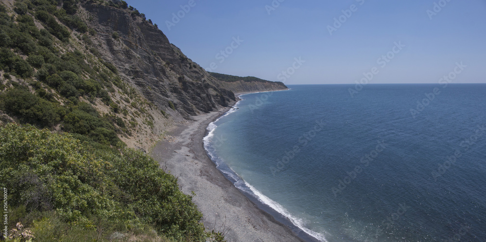 Summer landscape with mountains, azure water, sandy beach and blue sky in bright sunny day. Travel background. panorama