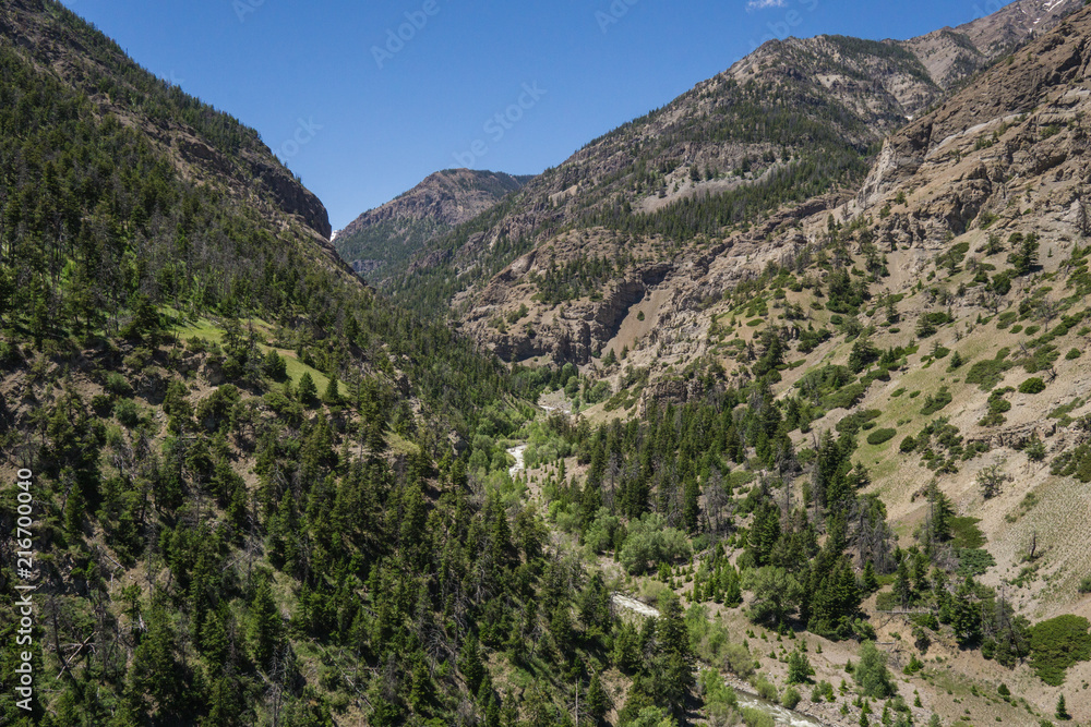 Mountain Peaks Lead into River Valley