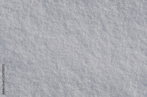 Texture of white fresh snow as background.