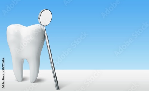 Big tooth and dentist mirror on desk