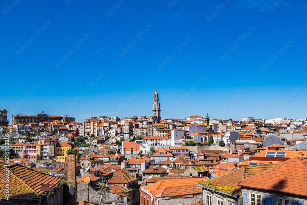 View of the rooftops in the center of Porto, Portugal.  Monumento a Garrett in the middle.