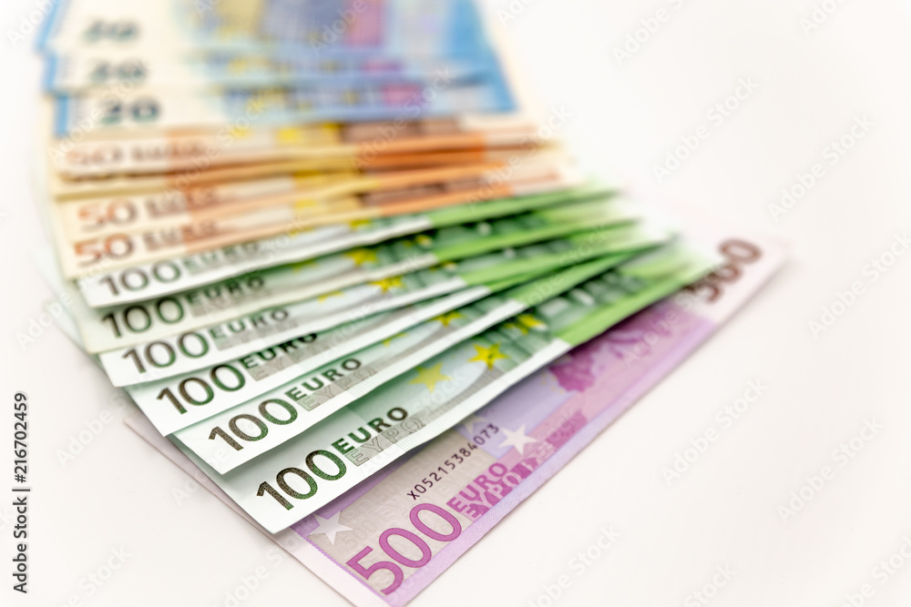 Spread Stack of Euro Banknotes, isolated close-up on white background