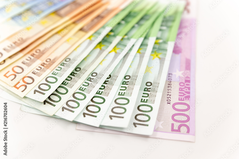 Spread Stack of Euro Banknotes, isolated close-up on white background Spread Stack of Euro Banknotes, isolated close-up on white background