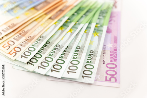 Spread Stack of Euro Banknotes, isolated close-up on white background