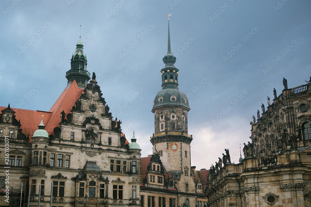 The Royal Palace and the Tower of Gaussmann in Dresden in Germany against the backdrop of the setting sun in the evening. This complex of buildings was built in the 16th century. The Royal Palace and the Tower of Gaussmann in Dresden in Germany against the backdrop of the setting sun in the evening. This complex of buildings was built in the 16th century.