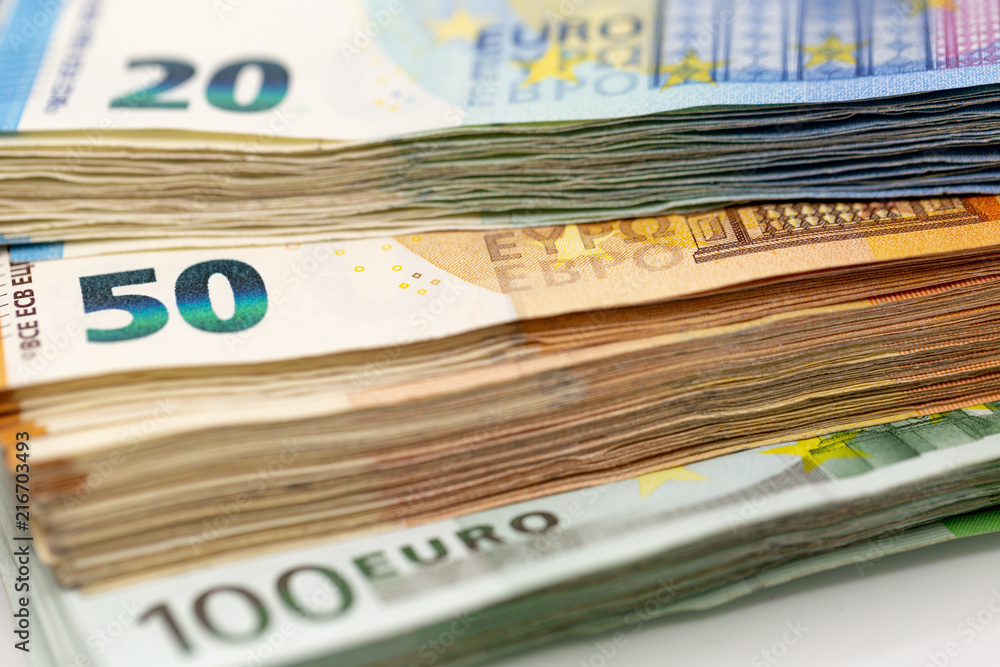 Pile of Euro Banknotes, isolated close-up on white background Pile of Euro Banknotes, isolated close-up on white background