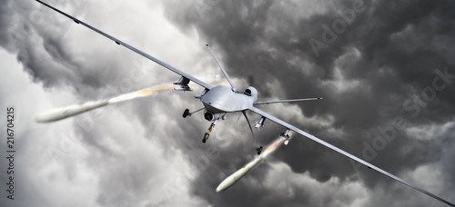 Drone strike .Front view of an unmanned aerial vehicle (UAV) military drone firing missile rockets at a target . 3d rendering