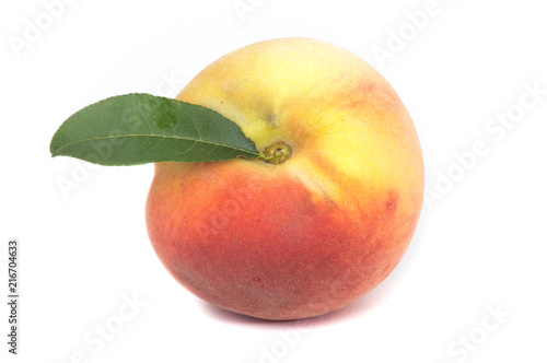 Fresh peach with leaf isolated on white background