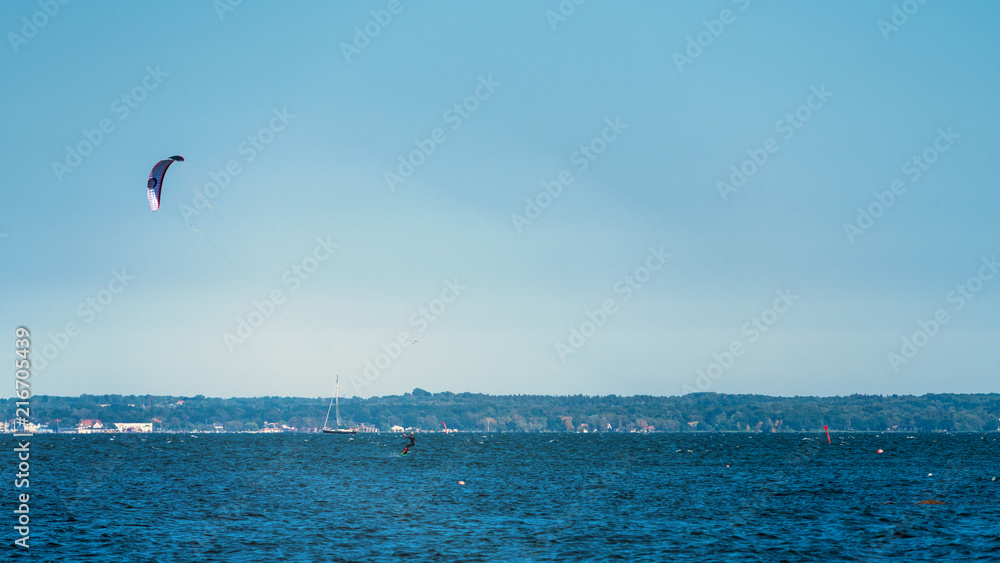 Fototapeta premium Kitesurfen on a beautiful blue ocean
