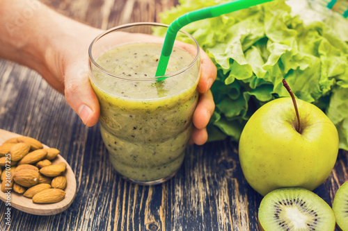 Wallpaper Mural Healthy green smoothie with kiwi, apple on rustic wood background. Torontodigital.ca