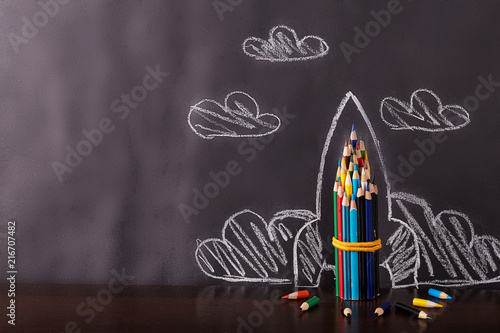 Rocket on black background. Back to school concept