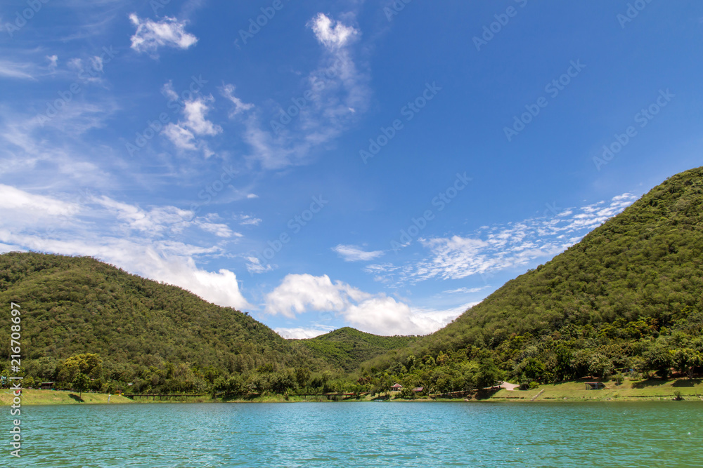 Scenery of mountain landscape with lake and sky,Beautiful the reservoir water and green mountain with blue sky and clouds beauty in Thailand