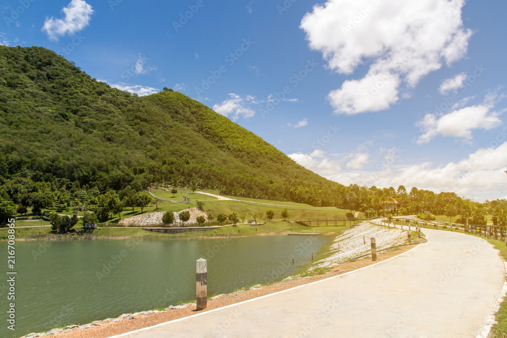 Fototapeta premium Scenery of mountain landscape with lake and sky,Beautiful the reservoir water and green mountain with blue sky and clouds beauty in Thailand