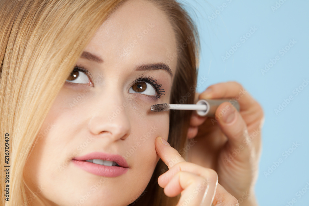 Woman getting make up done by artist Woman getting make up done by artist