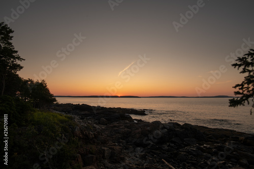 Sunrise by the ocean photo