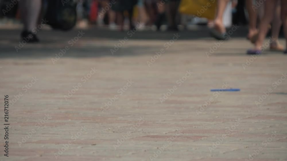 Close-up of foot walking people on the sidewalk. People hurrying about their business Close-up of foot walking people on the sidewalk. People hurrying about their business