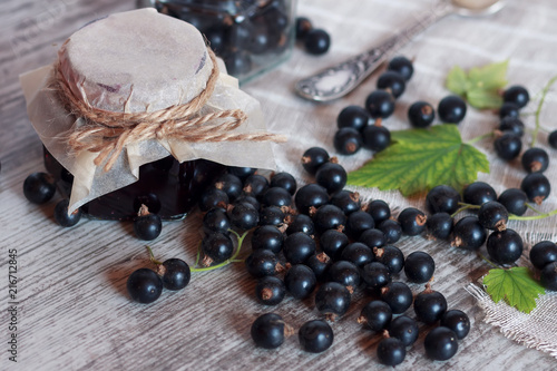 Fresh currants and jam in a jar photo