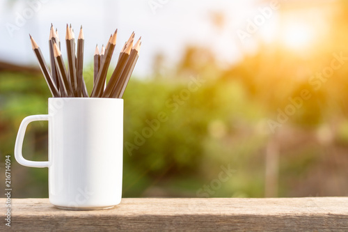 group of pencils in the white coffee cup.