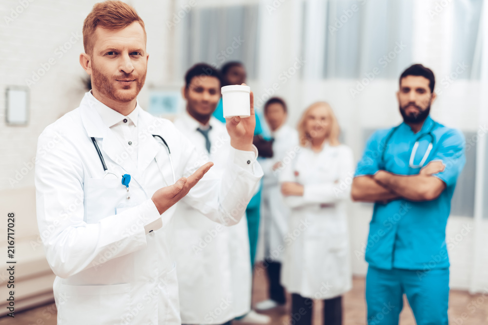 Professional Multinational Doctors Camera Posing. Professional Multinational Doctors Camera Posing.