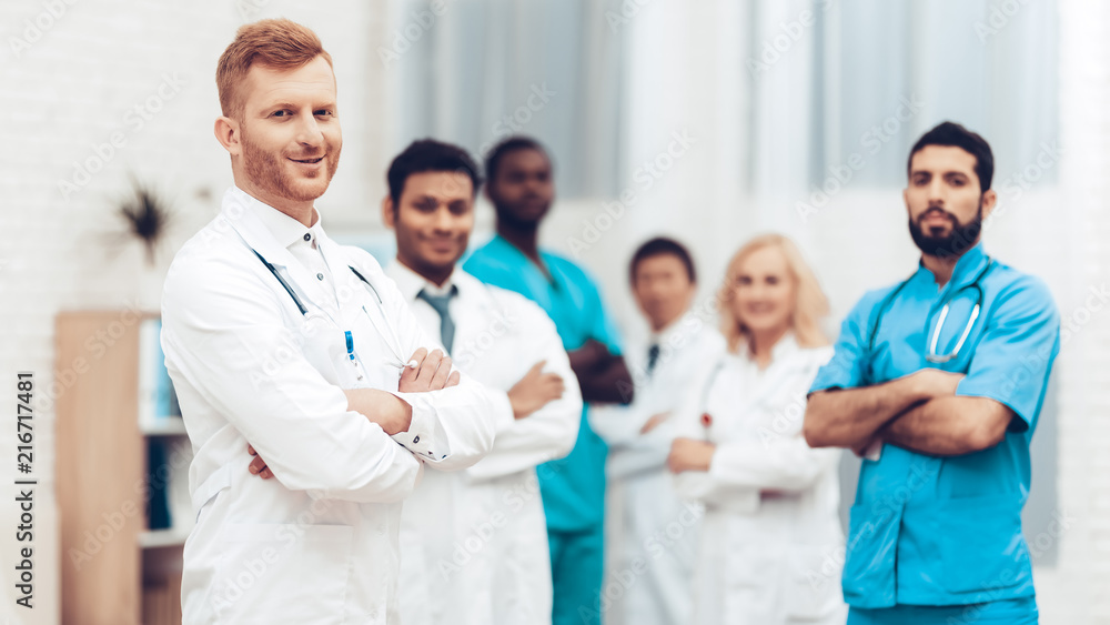Professional Multinational Doctors Camera Posing. Professional Multinational Doctors Camera Posing.