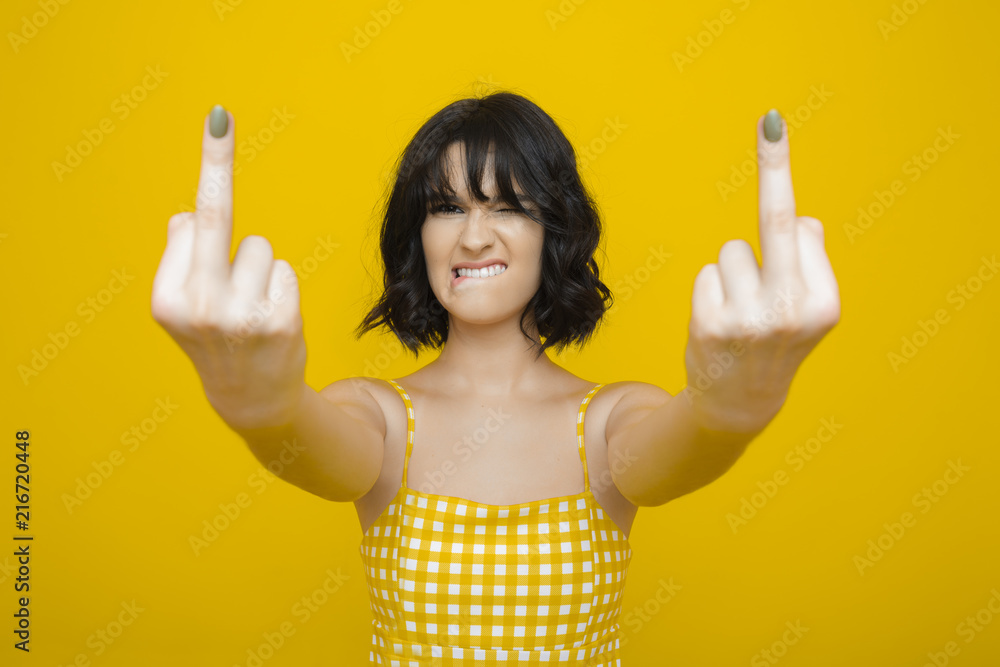 Young woman showing middle finger Young woman showing middle finger