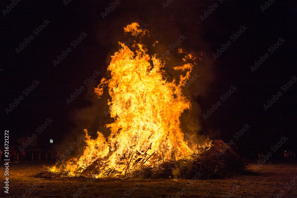 Fire flames with sparks and ember on black background Fire flames with sparks and ember on black background