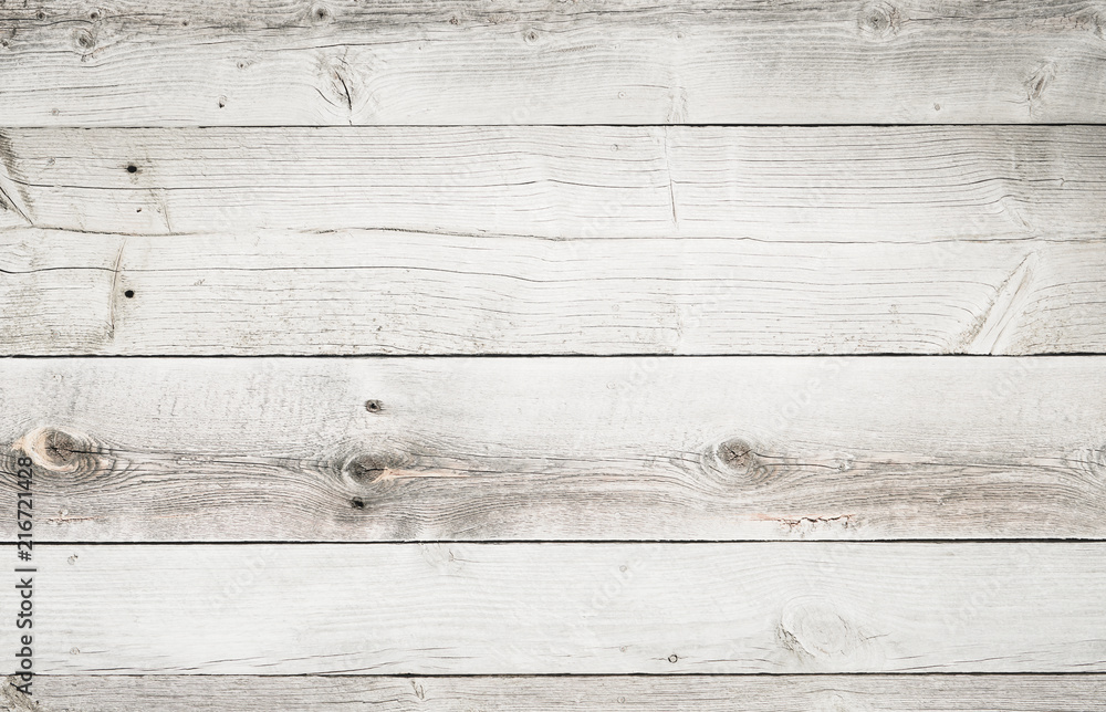 Naklejka premium Rustic weathered wood surface with long boards lined up. Wooden planks on a wall or floor with grain and texture. Multicolor background with light bleached flat neutral tones.