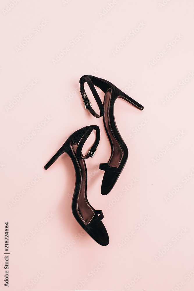 High-heels on pink background. Flat lay, top view minimal fashion concept. High-heels on pink background. Flat lay, top view minimal fashion concept.
