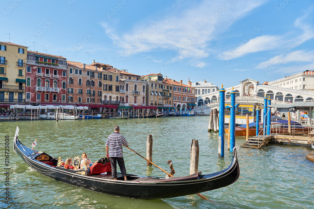 Romantic sommer scene of famous Canal Grande. Colorful panorama with Rialto Bridge. Picturesque cityscape of Venice, Italy, Europe. Traveling concept background.