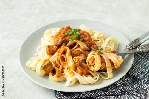 Vegetarian pasta (Tagliatelle) with zucchini, eggplant, bell pepper and tomato sauce.
