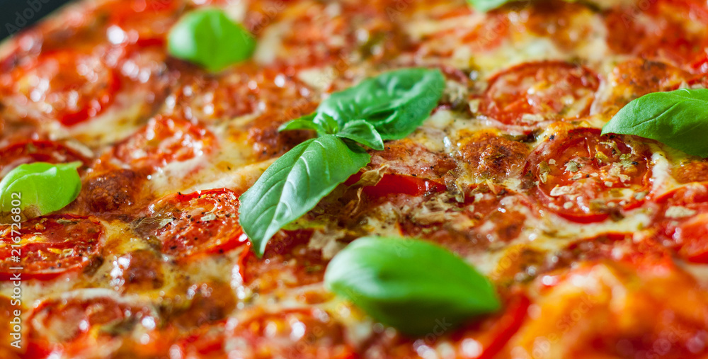 Pizza with Mozzarella cheese, Tomatoes, pepper, Spices and Fresh Basil. Italian pizza. Pizza Margherita or Margarita Pizza with Mozzarella cheese, Tomatoes, pepper, Spices and Fresh Basil. Italian pizza. Pizza Margherita or Margarita