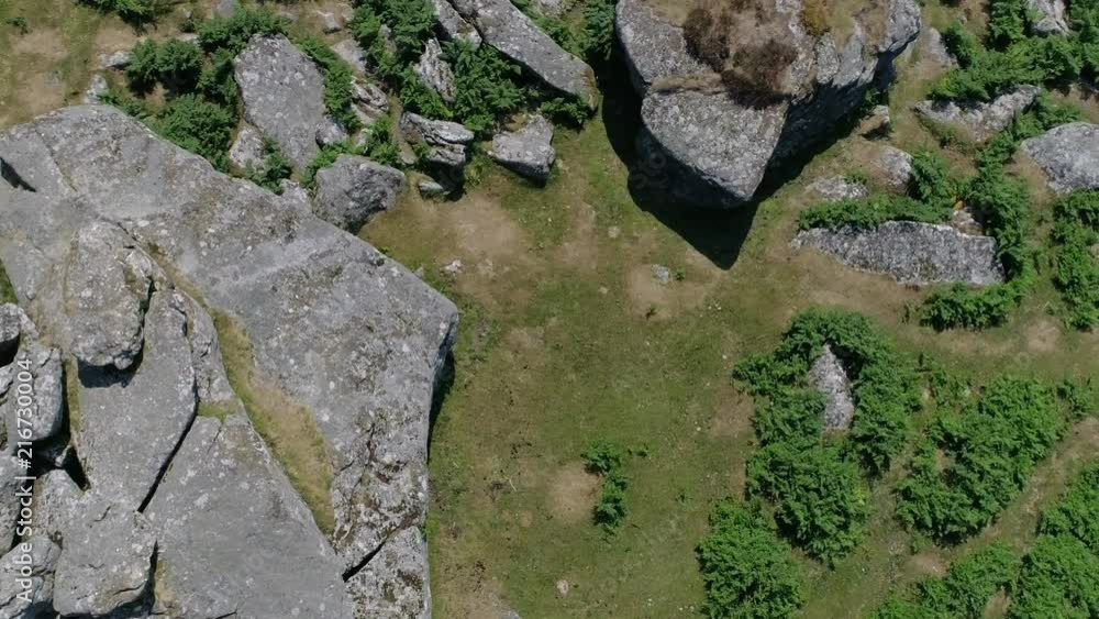 Tracking and rotating aerial of a rocky tor in the heart of dartmoor, England Tracking and rotating aerial of a rocky tor in the heart of dartmoor, England