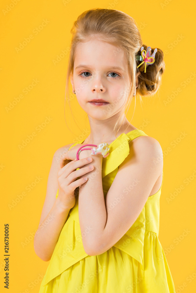 Girl posing on yellow background. Girl posing on yellow background.