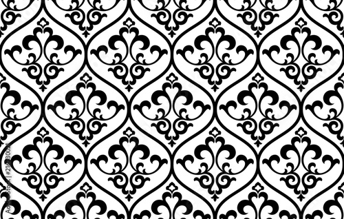 Wallpaper in the style of Baroque. Seamless vector background. White and black floral ornament. Graphic pattern for fabric, wallpaper, packaging. Ornate Damask flower ornament
