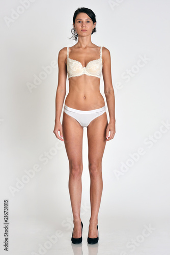 woman full length figure in front position in underwear.