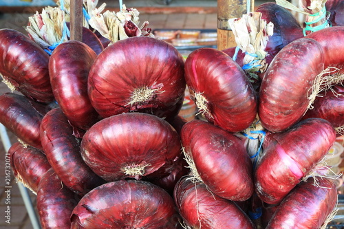 Picture of a bundle of red onions. photo