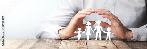 Protecting Hands Over Paper Family / Family Protection And Care Concept 