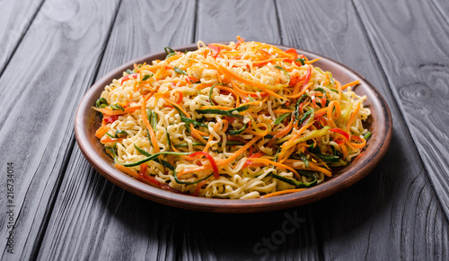 Asian noodles salad in bowl