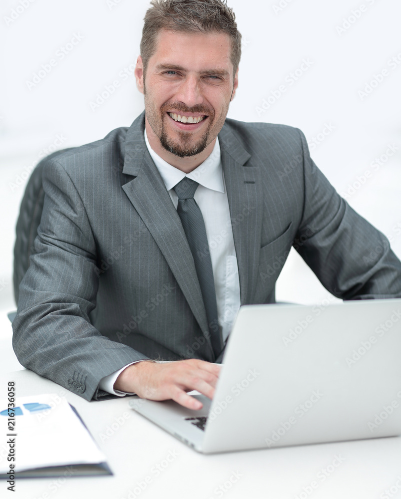 closeup.smiling businessman working with laptop closeup.smiling businessman working with laptop
