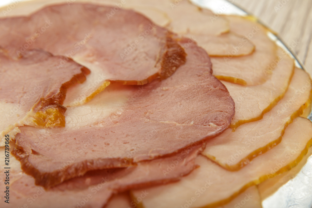 Sausage cuts of different varieties on a plate. Sausage cuts of different varieties on a plate.
