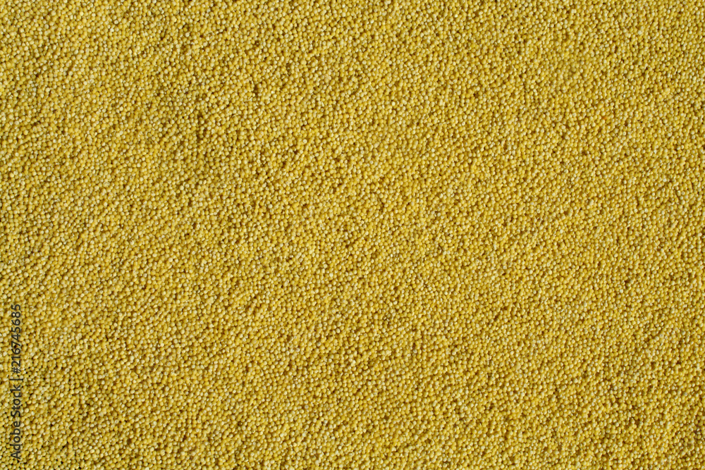 Yellow millet background. Polished millet texture and details Yellow millet background. Polished millet texture and details
