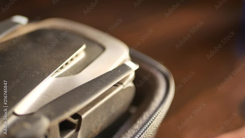 Unzipping and opening a case that contains a hi tech aerial drone Unzipping and opening a case that contains a hi tech aerial drone