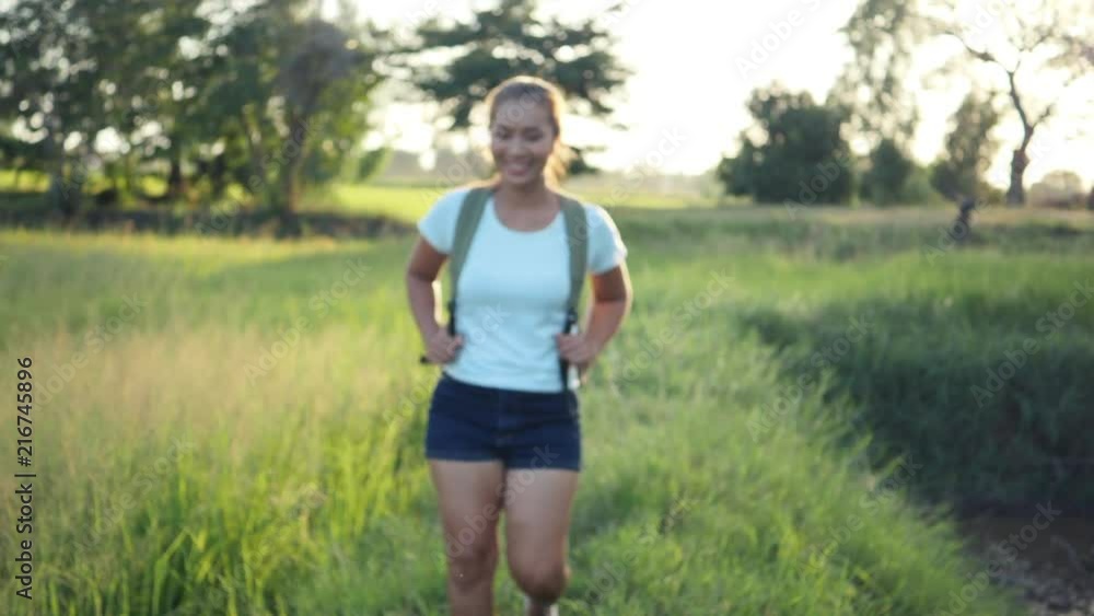 Slow motion, Happy woman hiker trekking on walking in forest Slow motion, Happy woman hiker trekking on walking in forest