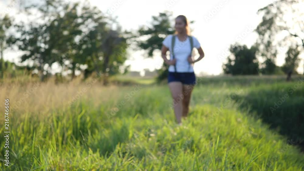 Slow motion, Happy woman hiker trekking on walking in forest Slow motion, Happy woman hiker trekking on walking in forest