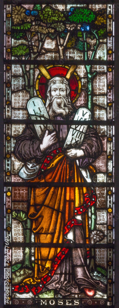 LONDON, GREAT BRITAIN - SEPTEMBER 19, 2017: The patriarch Moses on the stained glass in St Mary Abbot's church on Kensington High Street.