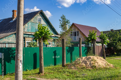 Private sector in the town of Ermolino, Borovskiy district, Kaluga region. Cropped trees
 photo